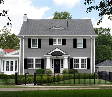 gray metal roof on gray house|grey houses with black shutters.